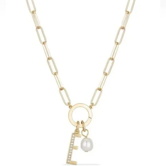 Photo 1 of UNWRITTEN Cubic Zirconia Initial & Freshwater Pearl 18" Pendant Necklace in Gold Plate
Freshwater pearl: 6mm
Set in fine silver plate or 14k gold flash-plated metal; cubic zirconia
Approx. length: 18"; approx. drop: 3/4"
Spring ring closure