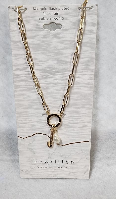 Photo 1 of UNWRITTEN Cubic Zirconia Initial & Freshwater Pearl 18" Pendant Necklace in Gold Plate
Freshwater pearl: 6mm
Set in fine silver plate or 14k gold flash-plated metal; cubic zirconia
Approx. length: 18"; approx. drop: 3/4"
Spring ring closure