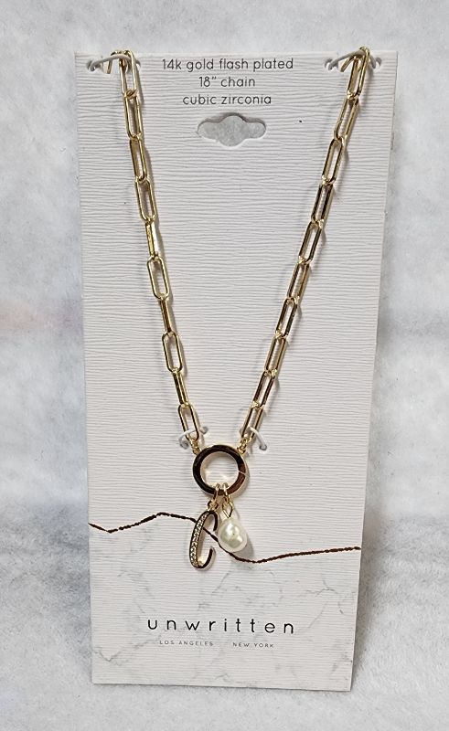 Photo 1 of UNWRITTEN Cubic Zirconia Initial & Freshwater Pearl 18" Pendant Necklace in Gold Plate
Freshwater pearl: 6mm
Set in fine silver plate or 14k gold flash-plated metal; cubic zirconia
Approx. length: 18"; approx. drop: 3/4"
Spring ring closure