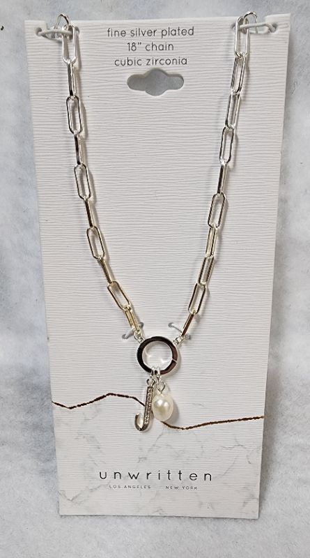 Photo 1 of UNWRITTEN Cubic Zirconia Initial & Freshwater Pearl 18" Pendant Necklace in Silver Plate
Freshwater pearl: 6mm
Set in fine silver plate or 14k gold flash-plated metal; cubic zirconia
Approx. length: 18"; approx. drop: 3/4"
Spring ring closure