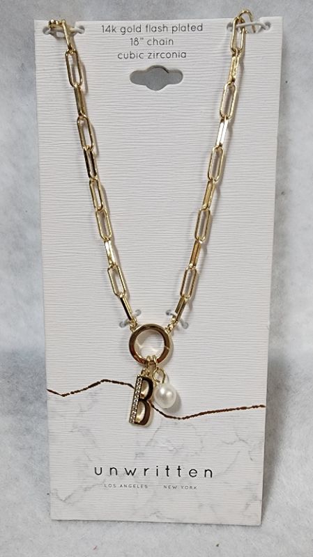 Photo 1 of UNWRITTEN Cubic Zirconia Initial & Freshwater Pearl 18" Pendant Necklace in Gold Plate
Freshwater pearl: 6mm
Set in fine silver plate or 14k gold flash-plated metal; cubic zirconia
Approx. length: 18"; approx. drop: 3/4"
Spring ring closure