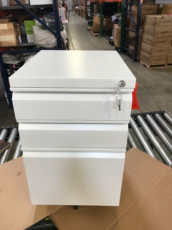 Photo 1 of 22in TALL WHITE FILE CABINET 3 DRAWERS WITH KEY. ONE KEY BENT