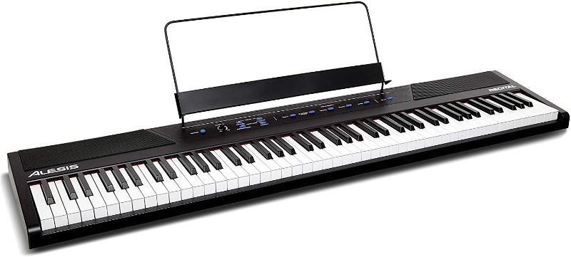 Photo 1 of Alesis, 88 Beginner Digital Piano/Keyboard with Full Size Semi Weighted Keys, Power Supply, Built in Speakers and 5 Premium Voices (Amazon Exclusive), (Recital)
