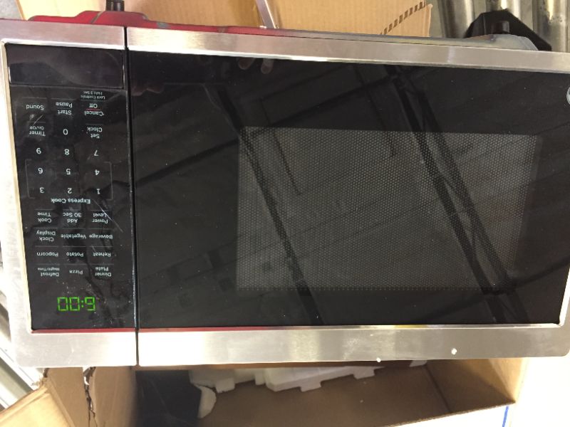 Photo 2 of GE - 0.9 Cu. Ft. Microwave - Stainless steel