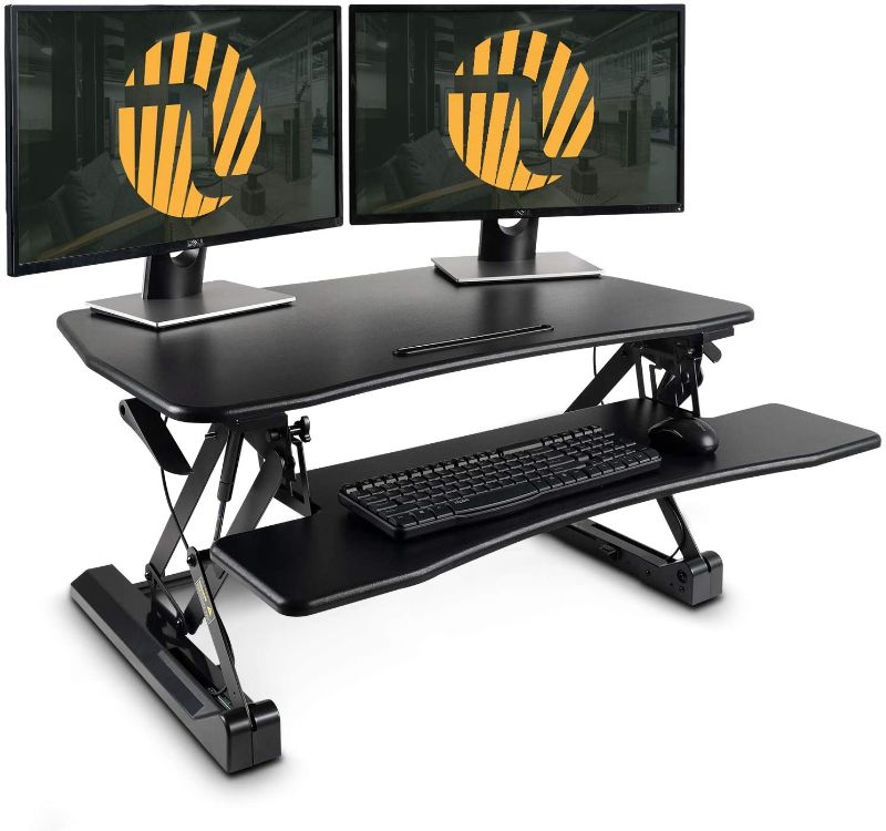 Photo 1 of Standing Desk Converter with Height Adjustable – FEZIBO Black 36 inches Stand Up Converter Sit to Stand Dual Monitor Tabletop Riser
