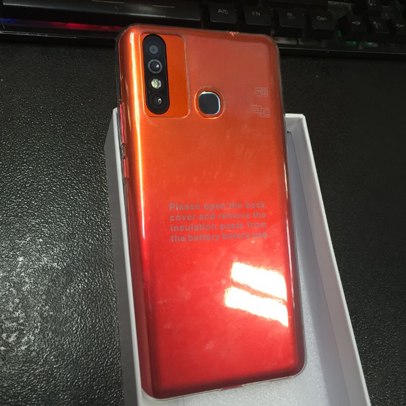 Photo 3 of generic android smartphone in orange missing charger