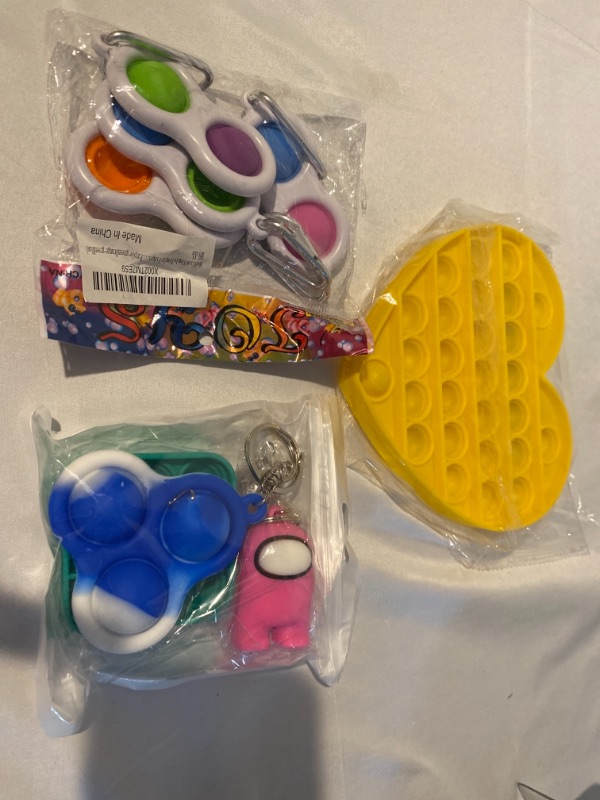 Photo 1 of 3PC LOT
SIMPLEDIMPLE FIGETS, YELLOW HEART BUBBLE POP, MULTI PACK MINI FIGETS