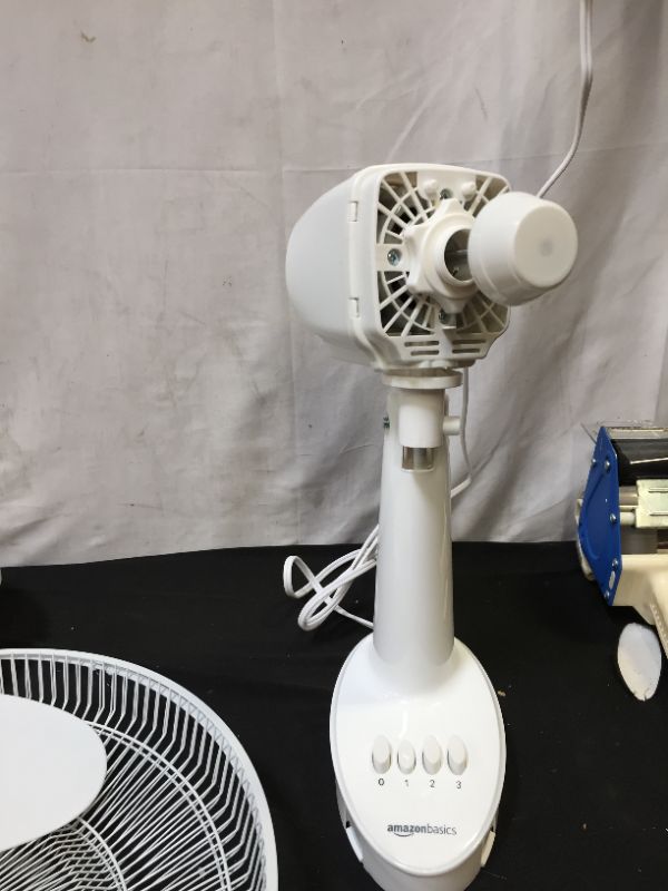 Photo 2 of Amazon Basics Oscillating Table Fan with 12-Inch Blades, 3 Speed Settings
