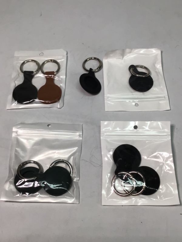 Photo 1 of 4 Packages- Silicone AirTag Protective Cases- 2 Cases per Package- Colors- 2 Black, 2 Black, 2 Dark Green, 1Black/1Brown- 8 Tags Total