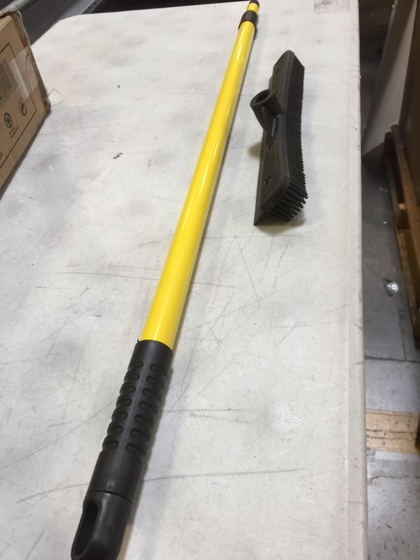 Photo 2 of a regular floor rubber brissel broom with extendion