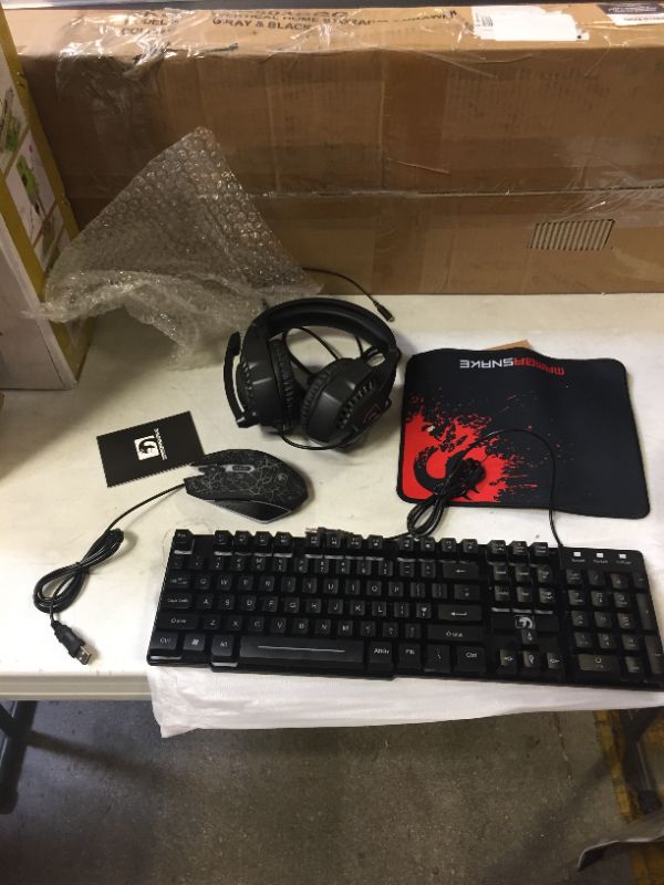 Photo 1 of gaming keyboard, mouse pad, mouse, headphones. 