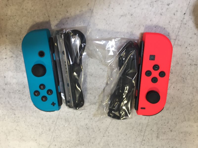 Photo 1 of Nintendo Joy-Con (L/R) - Neon Red/Neon Blue