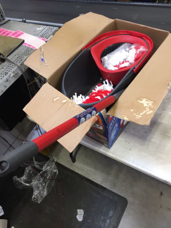 Photo 2 of EasyWring Microfiber Spin Mop and Bucket Floor Cleaning System with 2 Extra Power Refills