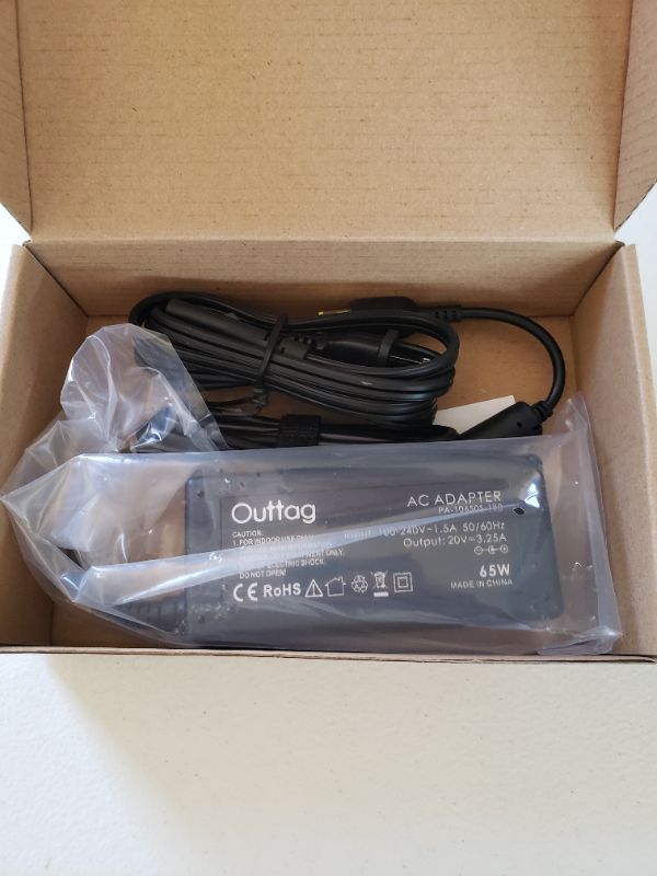 Photo 1 of OUTTAG 65W AC Adapter