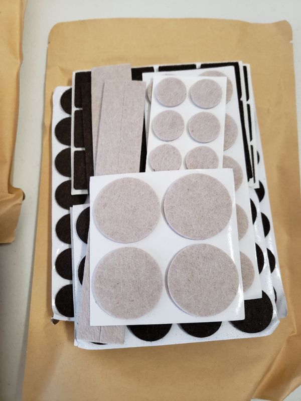 Photo 1 of Amazon Basics Felt Furniture Pads, Beige and Brown, 133 pcs. LOT OF 3.
