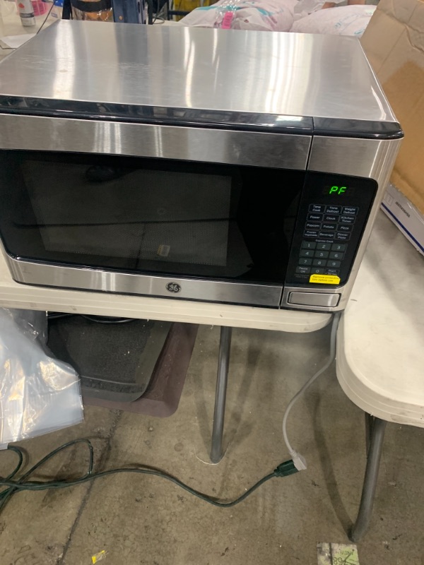 Photo 2 of GE - 1.1 Cu. ft. Mid-Size Microwave - Stainless Steel