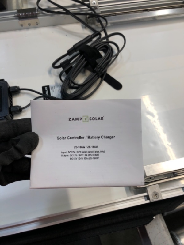 Photo 7 of *SEE last picture for damage*
Zamp solar Legacy Series 230-Watt Portable Solar Panel Kit with Integrated Charge Controller and Carrying Case. Off-Grid Solar Power for RV Battery Charging - USP1004
