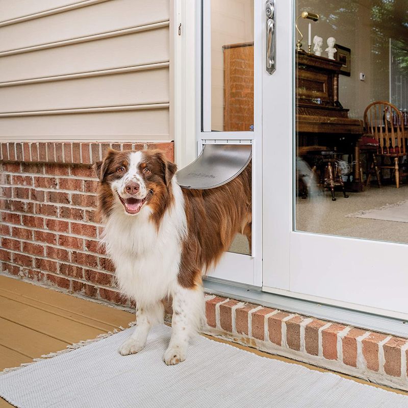 Photo 1 of *MISSING manual* 
PetSafe Sliding Glass Pet Doors - Extreme Weather Door or 2-Piece Standard Door - Cat or Dog Door Great for Apartments and Rentals - No Cutting DIY Installation - Fits 81 in Patio Sliding Doors, Flap opening is 10 1/4 W x 16 3/8 in H 
