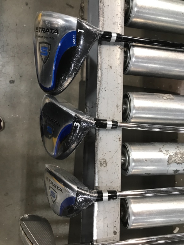 Photo 1 of **MISSING PW/INCOMPLETE SET**
Callaway Golf Men's Strata Complete Set 
The Strata 12 piece set is designed for maximum performance right out of the box; The set includes: Driver, 3 Wood, 5 Hybrid, 6 - 9 Iron, PW, Putter, Stand Bag and 2 Head covers

Color