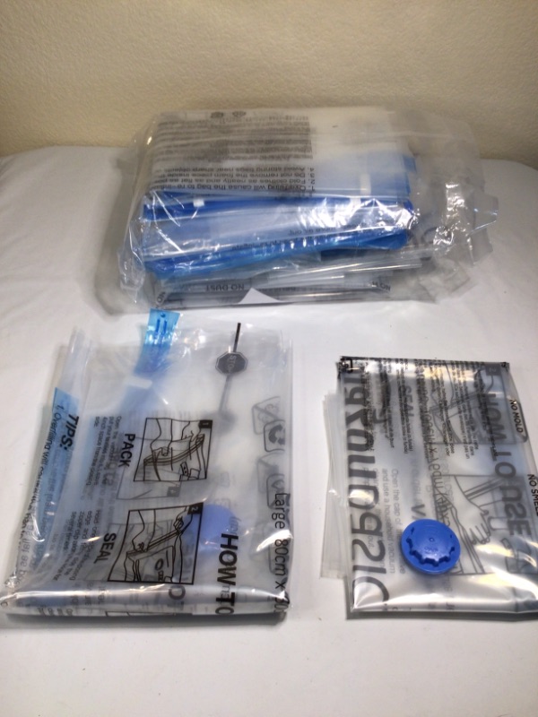 Photo 1 of Amazon Basics Vacuum Compression Storage Bags with Hand Pump - 15-Pack (2 X-Jumbo, 5 Jumbo, 4 Large, 4 Medium)