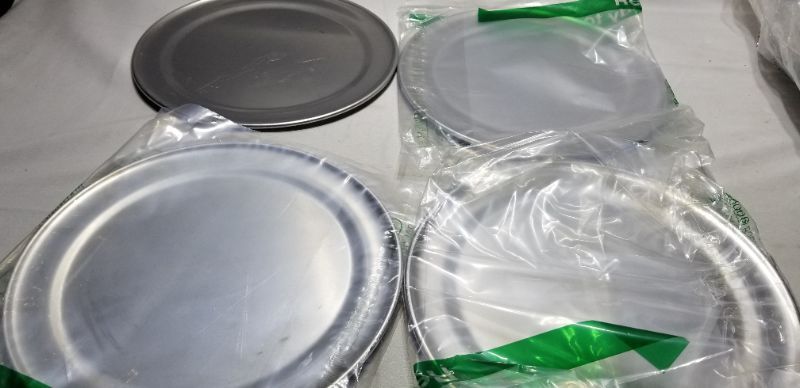 Photo 1 of Flat Personal Pizza Pans, Silver, Set of 4