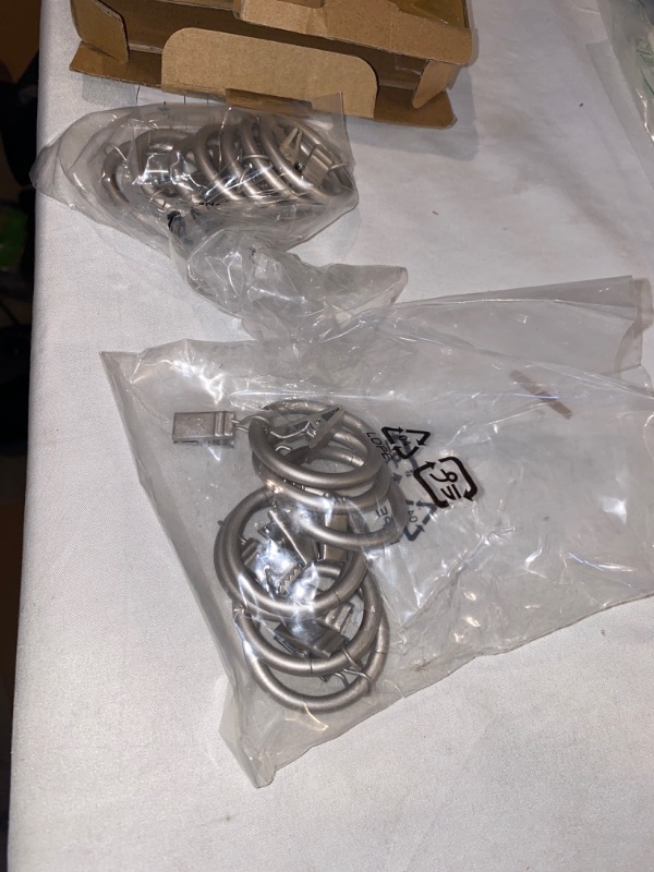 Photo 3 of 2PC LOT
Amazon Basics Curtain Rod Clip Rings for 1" Rod, Set of 7, Silver Nickel, 2 COUNT, USED, OPENED BOX