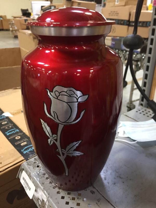 Photo 1 of red urn with a rose pattern 