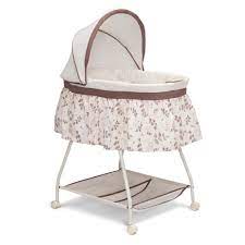 Photo 1 of Delta Children Deluxe Sweet Beginnings Bassinet, Falling Leaves