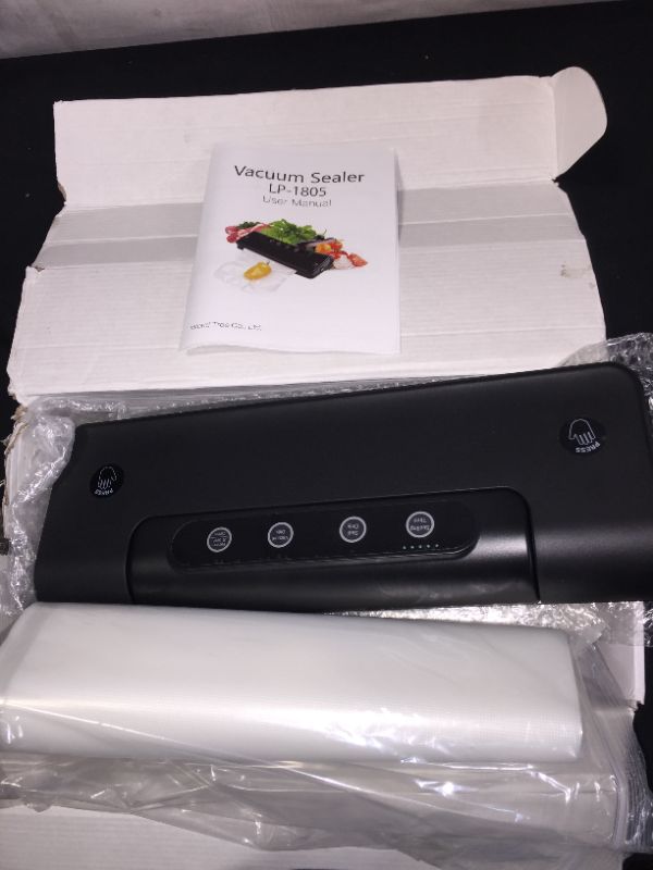 Photo 1 of VACUUM BAG SEALER COMES WITH BAGS INCLUDED