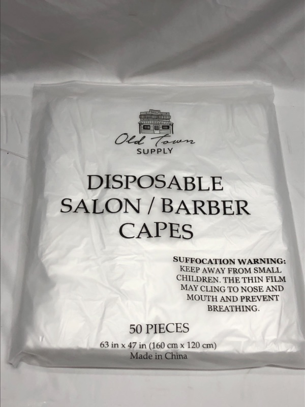 Photo 1 of BARBER DISPOSABLE CAPES 50 PACK 