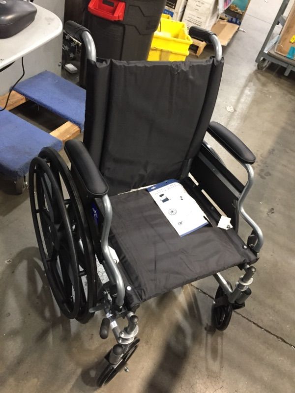 Photo 2 of Medline - MDS806550E Lightweight & User-Friendly Wheelchair With Flip-Back, Desk-Length Arms & Elevating Leg Rests for Extra Comfort, Black, 18" Seat
