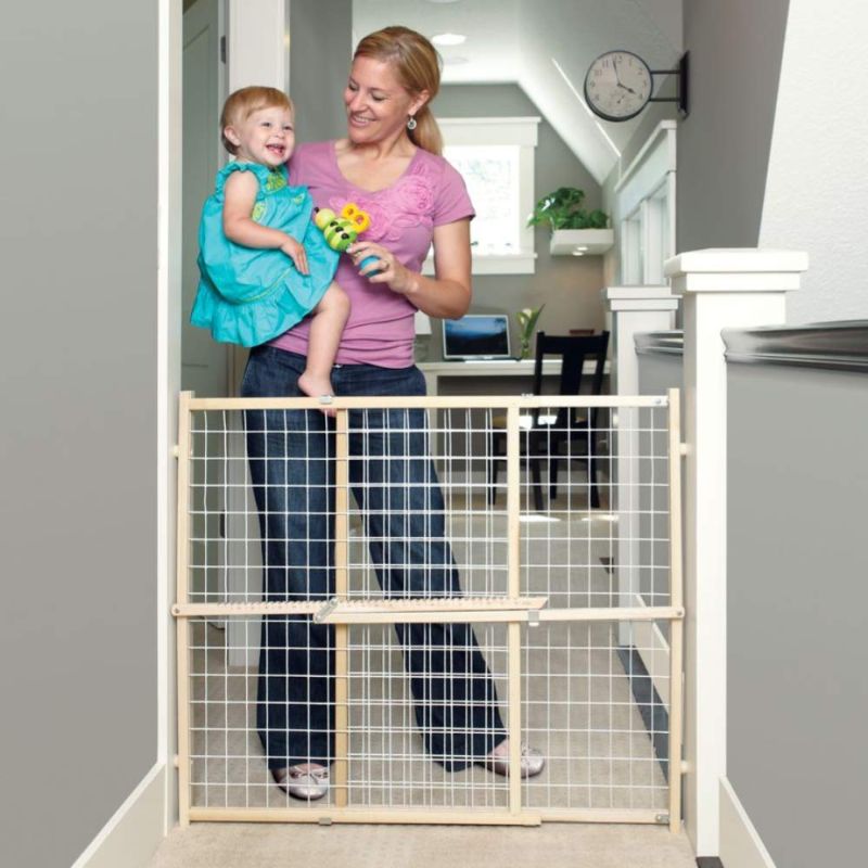 Photo 1 of Toddleroo by North States 50" Wide Extra Wide Wire Mesh Baby Gate: Installs in Extra Wide Opening in Second Without damaging Wall. Pressure Mount. Fits 29.5"-50" Wide (32" Tall, Sustainable Hardwood)
