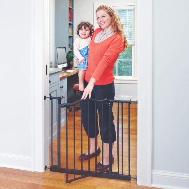 Photo 1 of Toddleroo by North States 38.25” wide Portico Arch Baby Gate: Decorative heavy duty metal safety gate with one hand operation. Pressure Mount. Fits 28.25"- 38.25" wide (28.5" tall, Bronze)
