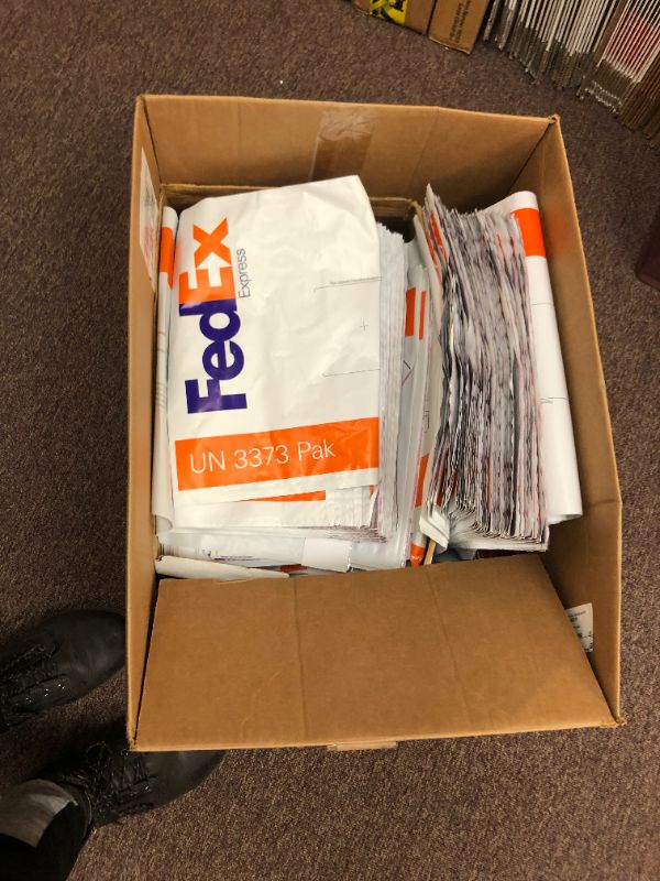 Photo 1 of Box of UPS and FedEx Shipping Bags