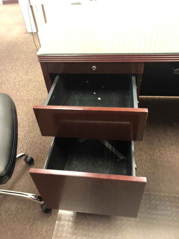 Photo 7 of Large Dark Cherry Colored U Shaped Desk With Glass Top and Storage Hutch and Black Office Chair Black and Silver Floor Mat Included