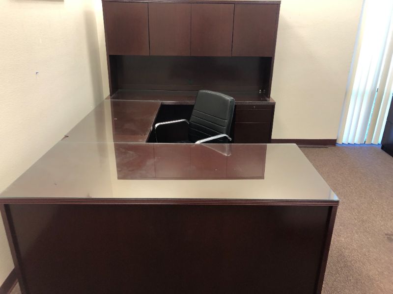 Photo 10 of Large Dark Cherry Colored U Shaped Desk With Glass Top and Storage Hutch and Black Office Chair Black and Silver Floor Mat Included