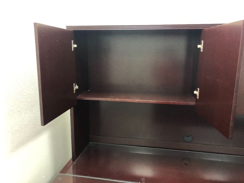 Photo 3 of Large Dark Cherry Colored U Shaped Desk With Glass Top and Storage Hutch and Black Office Chair Black and Silver Floor Mat Included