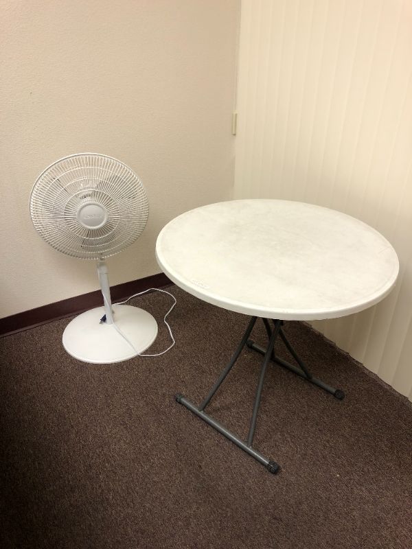 Photo 1 of portable round table and oscillating fan sold as set sold as is 