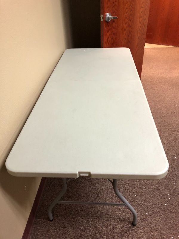 Photo 2 of portable table and 3 step ladder used sold as is 