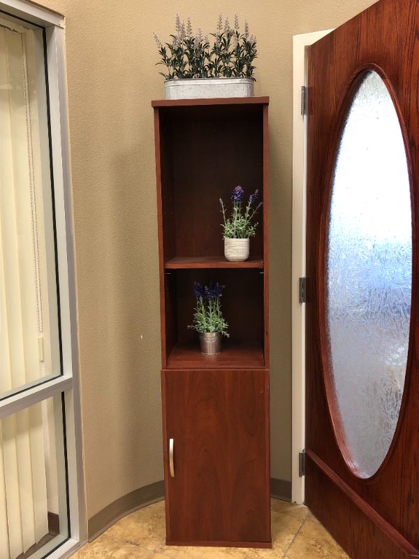 Photo 1 of large wooden cabinet with artificial decorative plants sold as is 