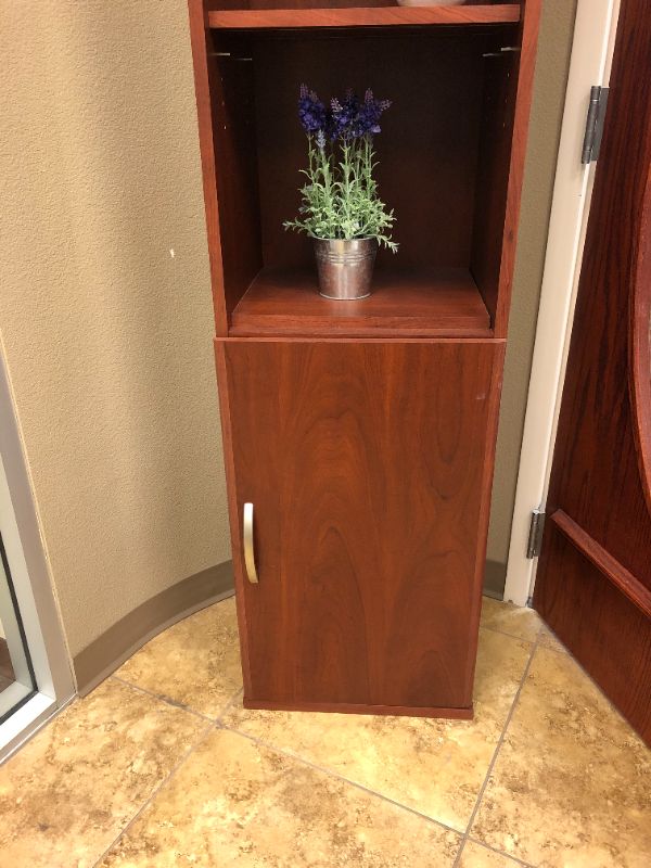 Photo 3 of large wooden cabinet with artificial decorative plants sold as is 