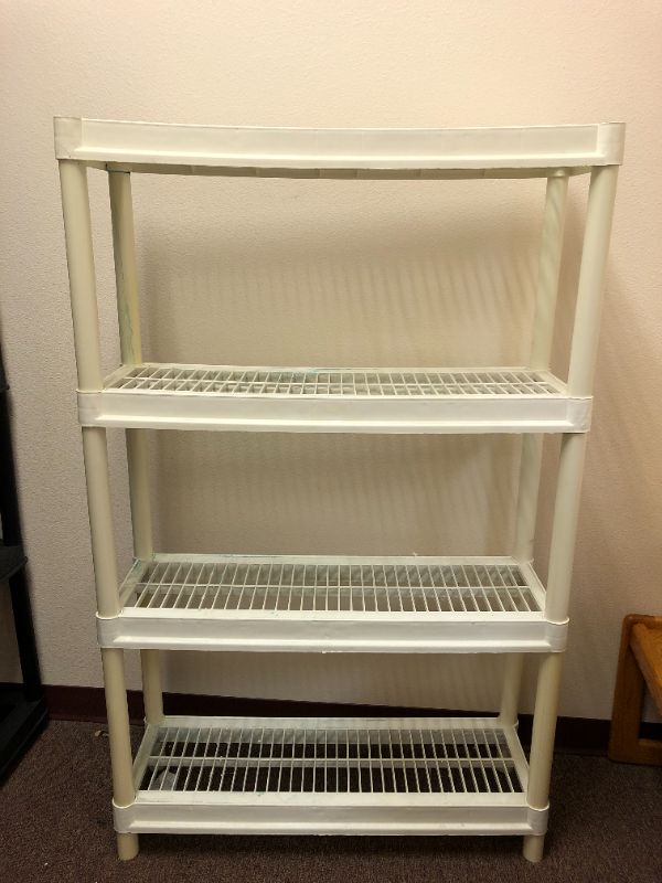 Photo 2 of set of 3 plastic storage racks used sold as is 2 black 1 white 