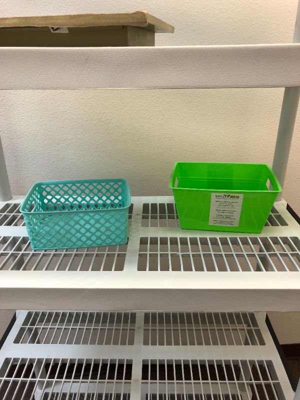 Photo 2 of plastic storage rack with 2 small storage baskets included used sold as is 