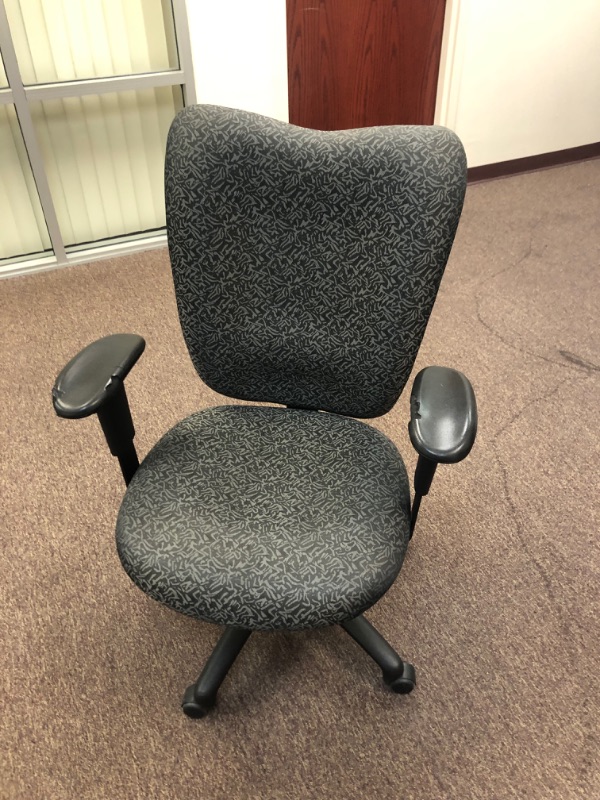 Photo 1 of Cushioned office chair. 