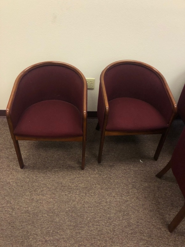 Photo 4 of 5 Red Cushioned Chairs with Wooden Armrests and legs.