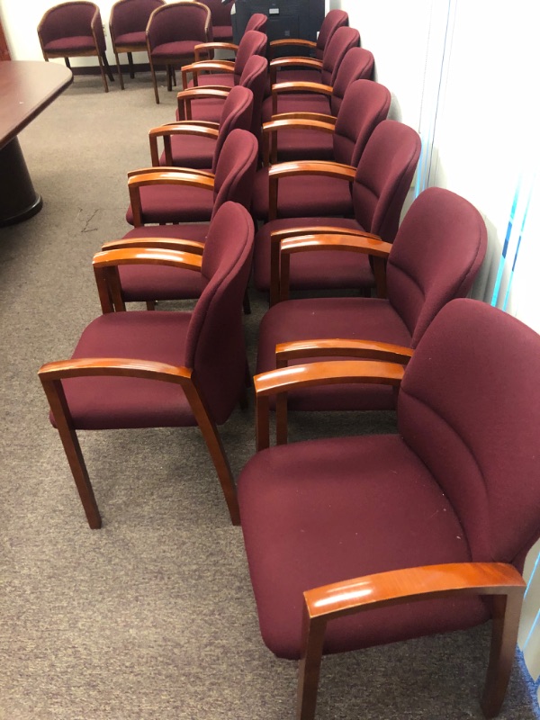 Photo 3 of 13 Red Cushioned chairs with Wooden armrests and legs.