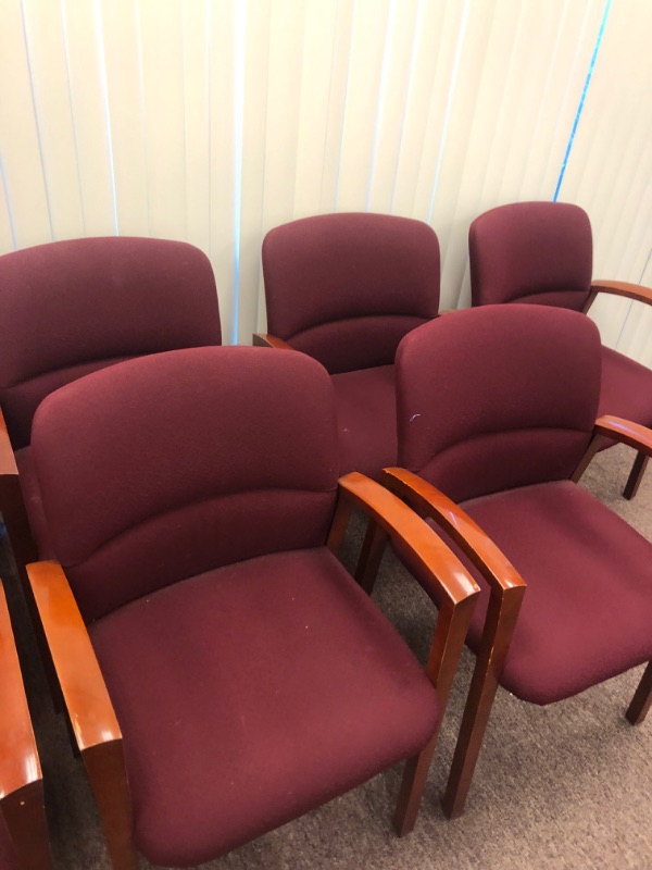 Photo 2 of 13 Red Cushioned chairs with Wooden armrests and legs.