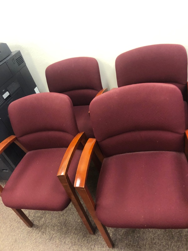 Photo 6 of 13 Red Cushioned chairs with Wooden armrests and legs.