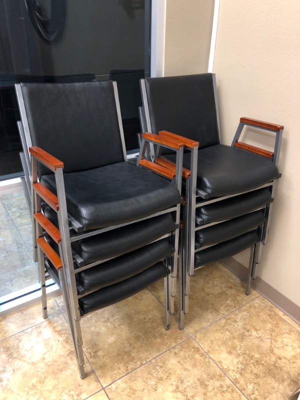 Photo 1 of 8 Black office chairs with wooden arm rests and metal frame. Sold as is