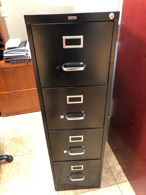 Photo 1 of Black metal 4 drawer vertical office cabinet.